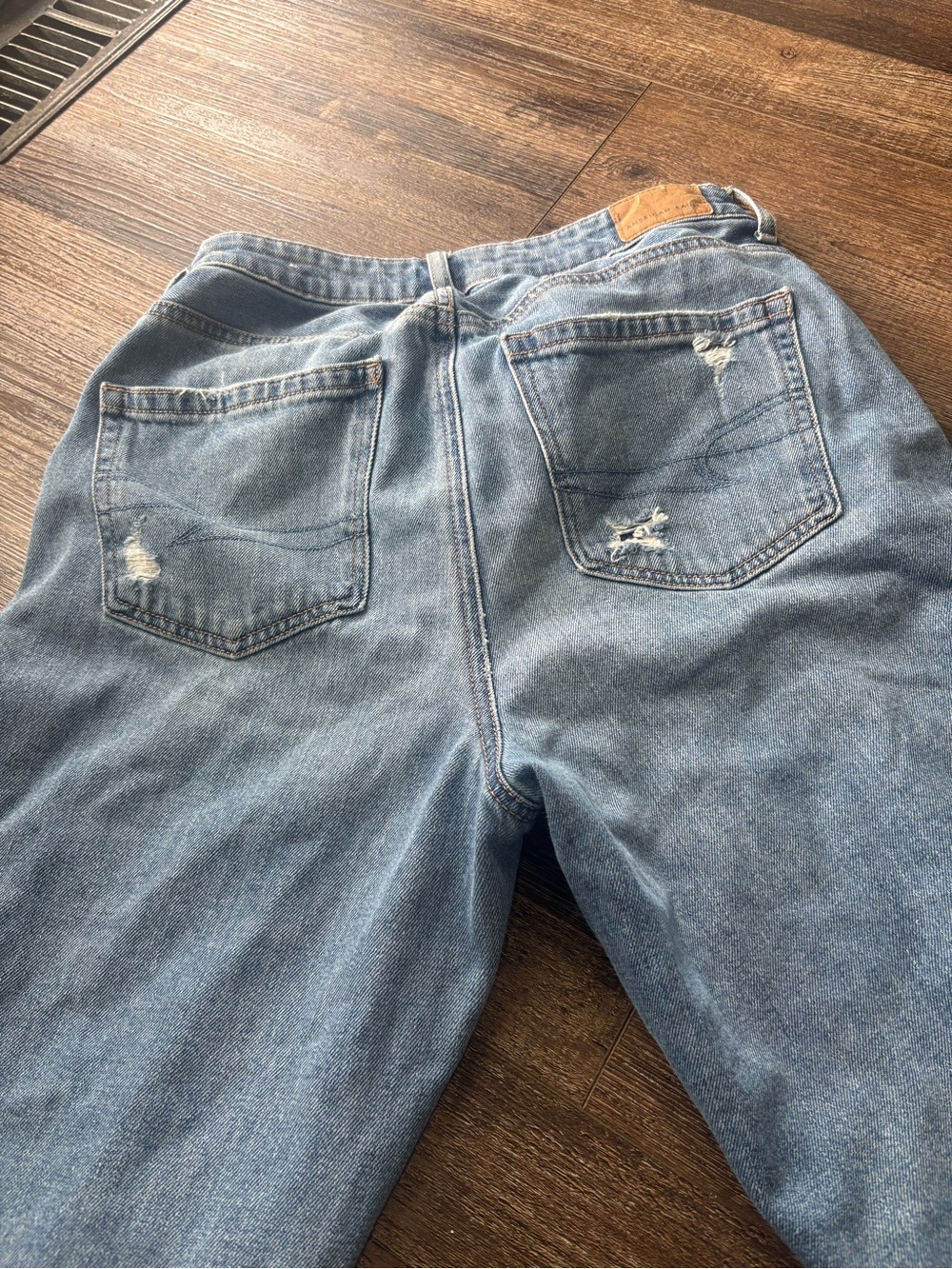 American Eagle Outfitters Light Wash Straight Leg Jeans with Subtle Distressing